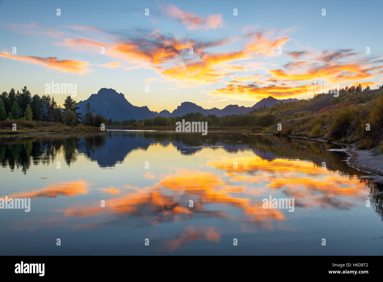 Beautiful colorful sunset reflected in the Snake River in Grand Teton National Park Stock Photo