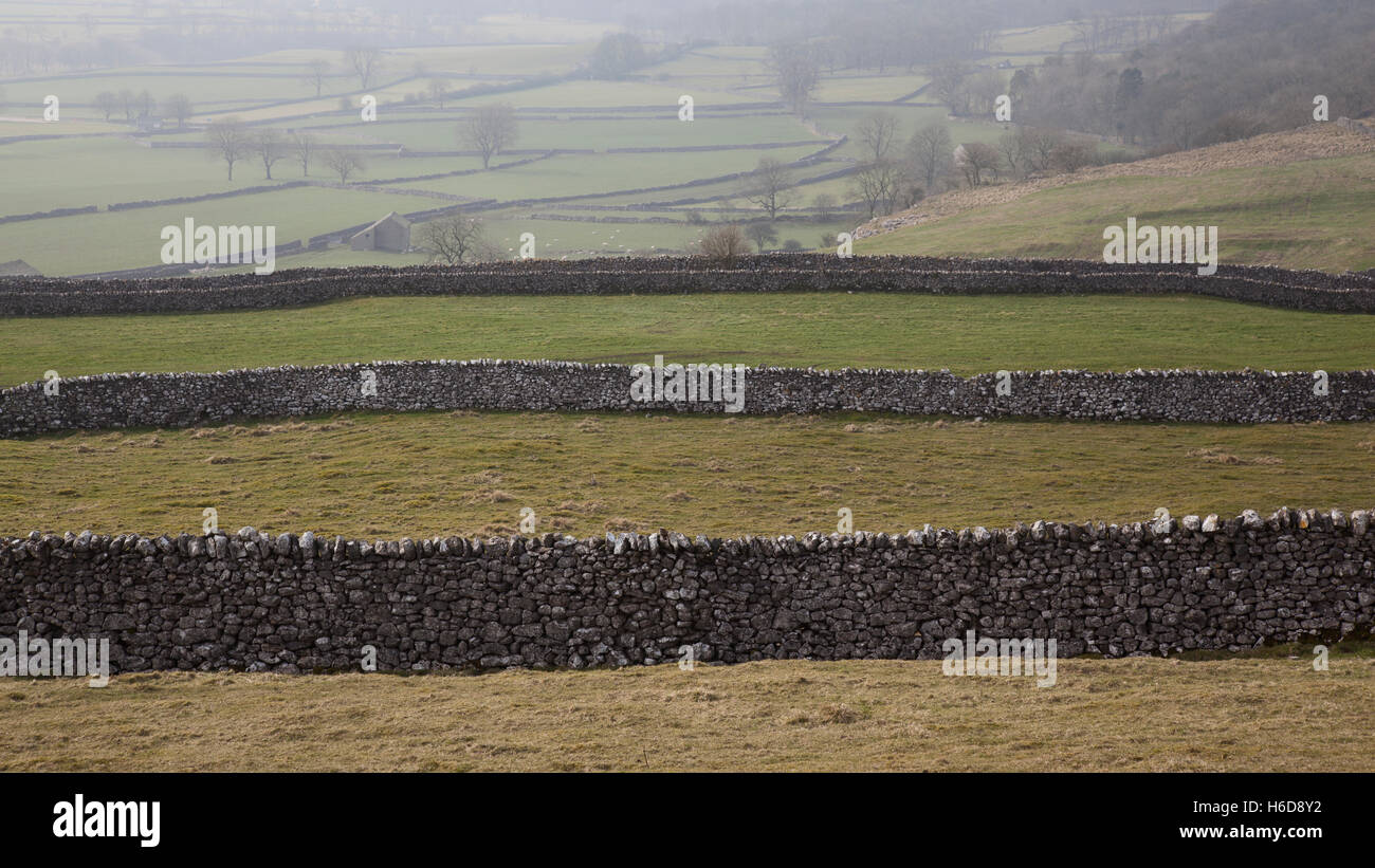 Dry stone walls on the Dales Way footpath near Grassington, Wharfedale, Yorkshire Dales, UK Stock Photo
