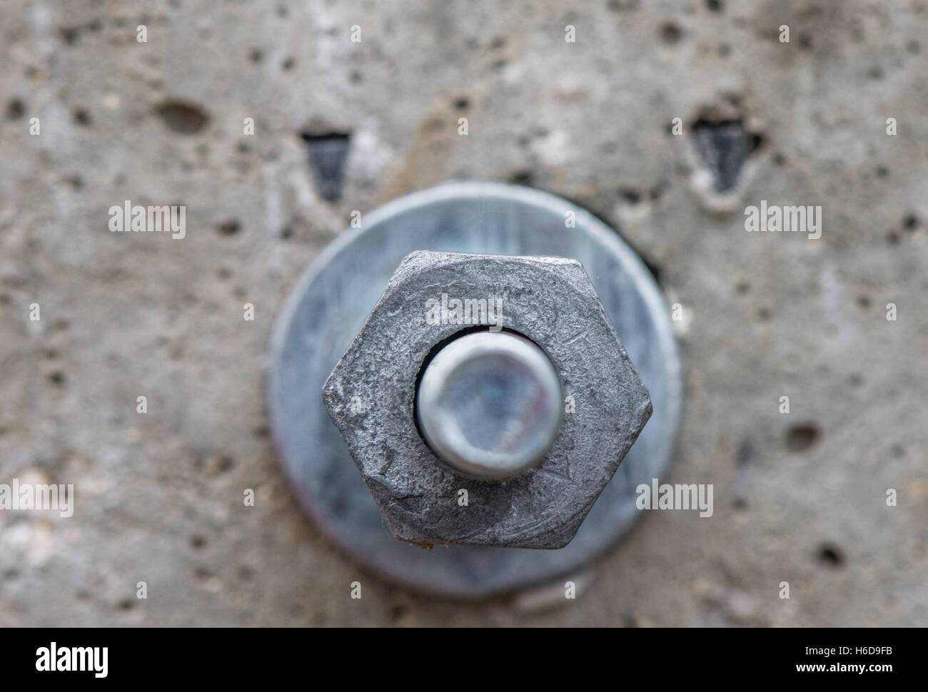 Nut and bolt fixings through a concrete post Stock Photo Alamy