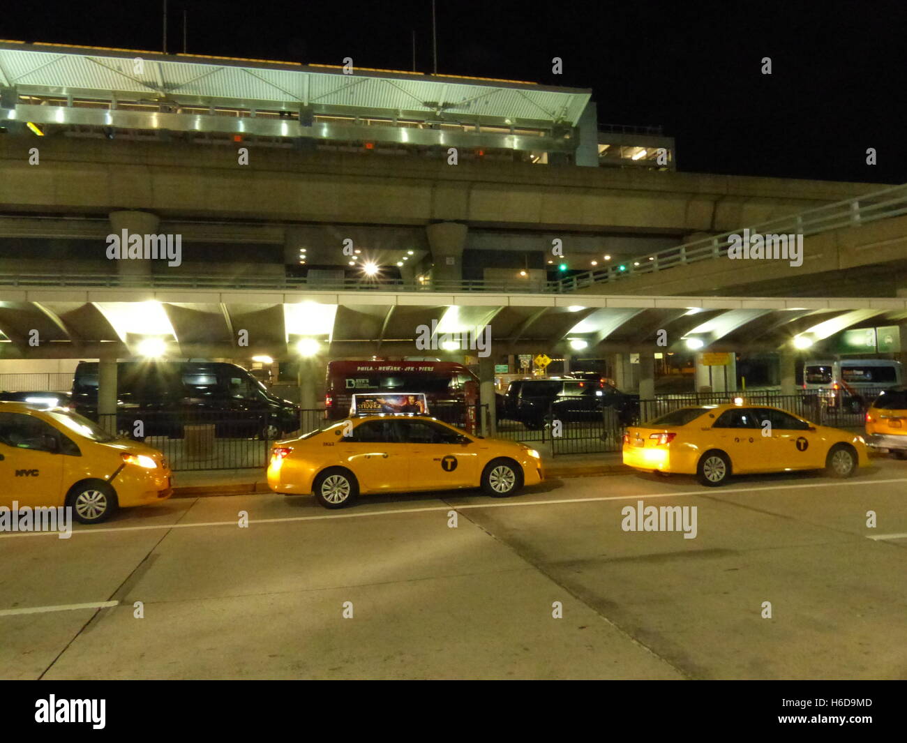 Yellow cabs waiting for passenger at British Airways Terminal at John