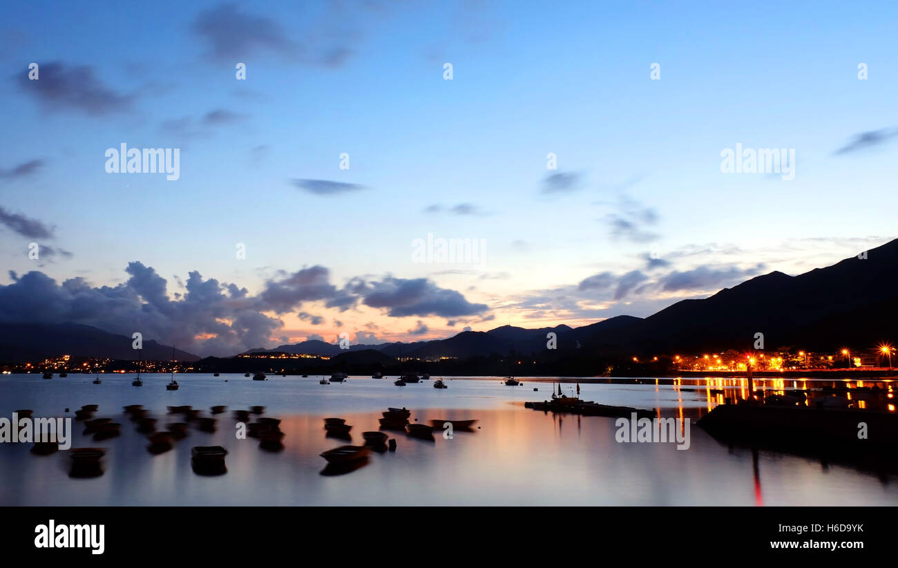 The silhouette of fishing recreational boat at sunset Stock Photo - Alamy
