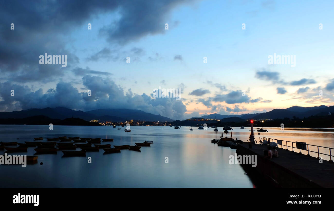 The silhouette of fishing recreational boat at sunset Stock Photo - Alamy