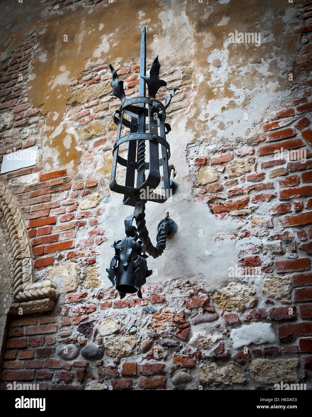 Ancient metal ornate light on the Juliet's house wall, Verona,  northern Italy’s Veneto region, Europe Stock Photo