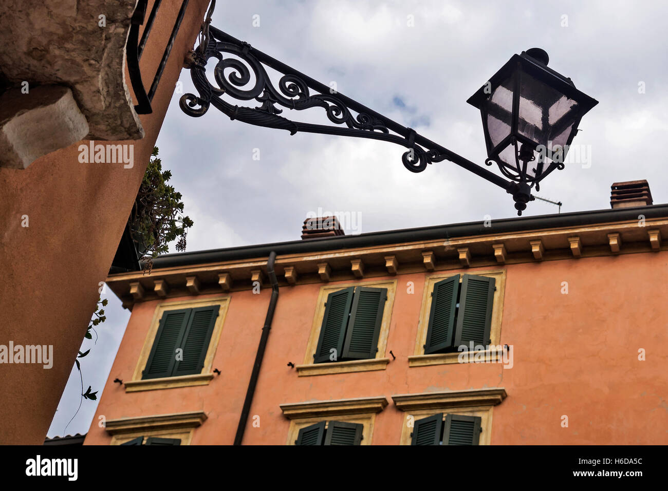 Antique decorative iron light above old street, Verona,  northern Italy’s Veneto region, Europe Stock Photo