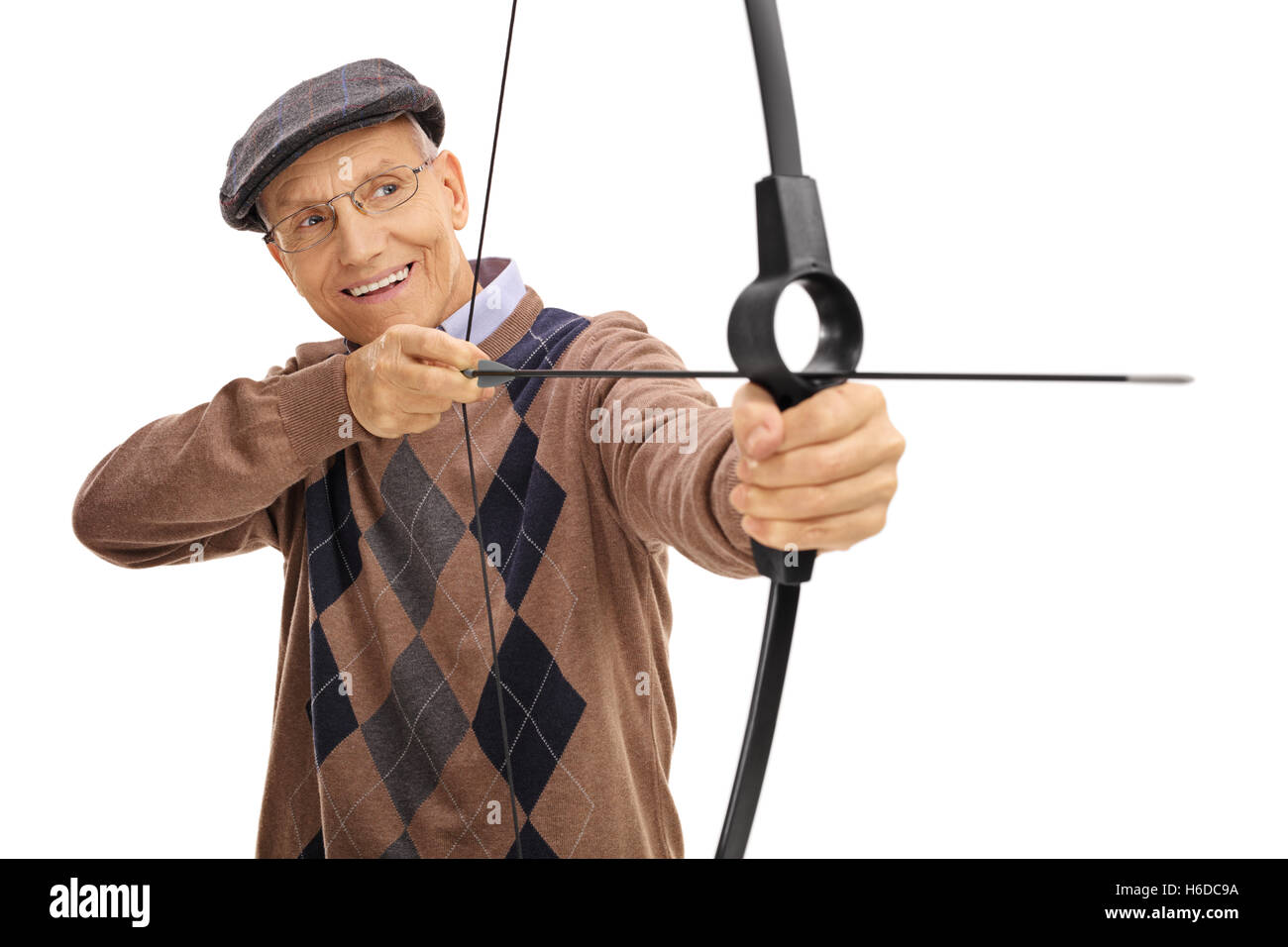 Mature man aiming with a bow and arrow isolated on white background Stock Photo