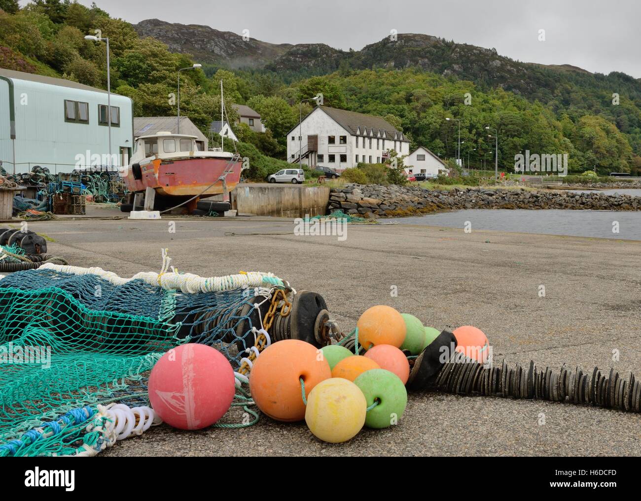 Fishing net and coloured floats on the pier in Gairloch, Wester Ross, Highland, Scotland Stock Photo