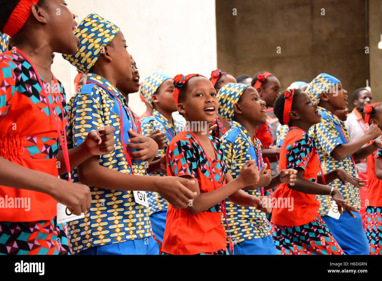 Edinburgh, Scotland, United Kingdom, 27, October, 2016.Some of 'The Singing Children of Africa' choir from Kenya, part of the 'Educate the Kids' charity, wave saltire flags as they perform in the Scottish Parliament, Credit:  Ken Jack / Alamy Live News Stock Photo