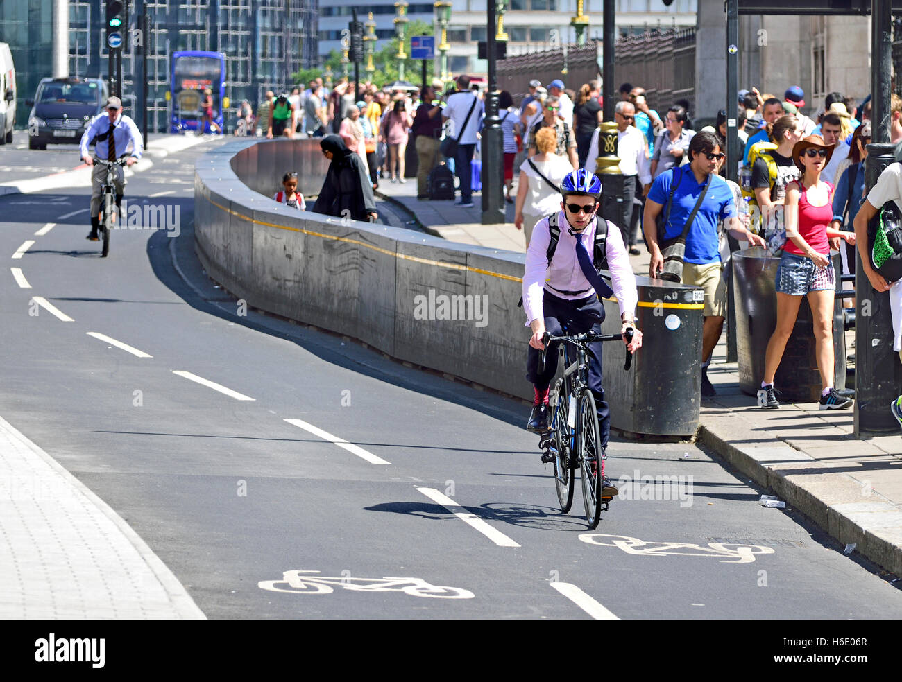 London, England, UK. Cyclists using the new cycle lane on Westminster Bridge Stock Photo