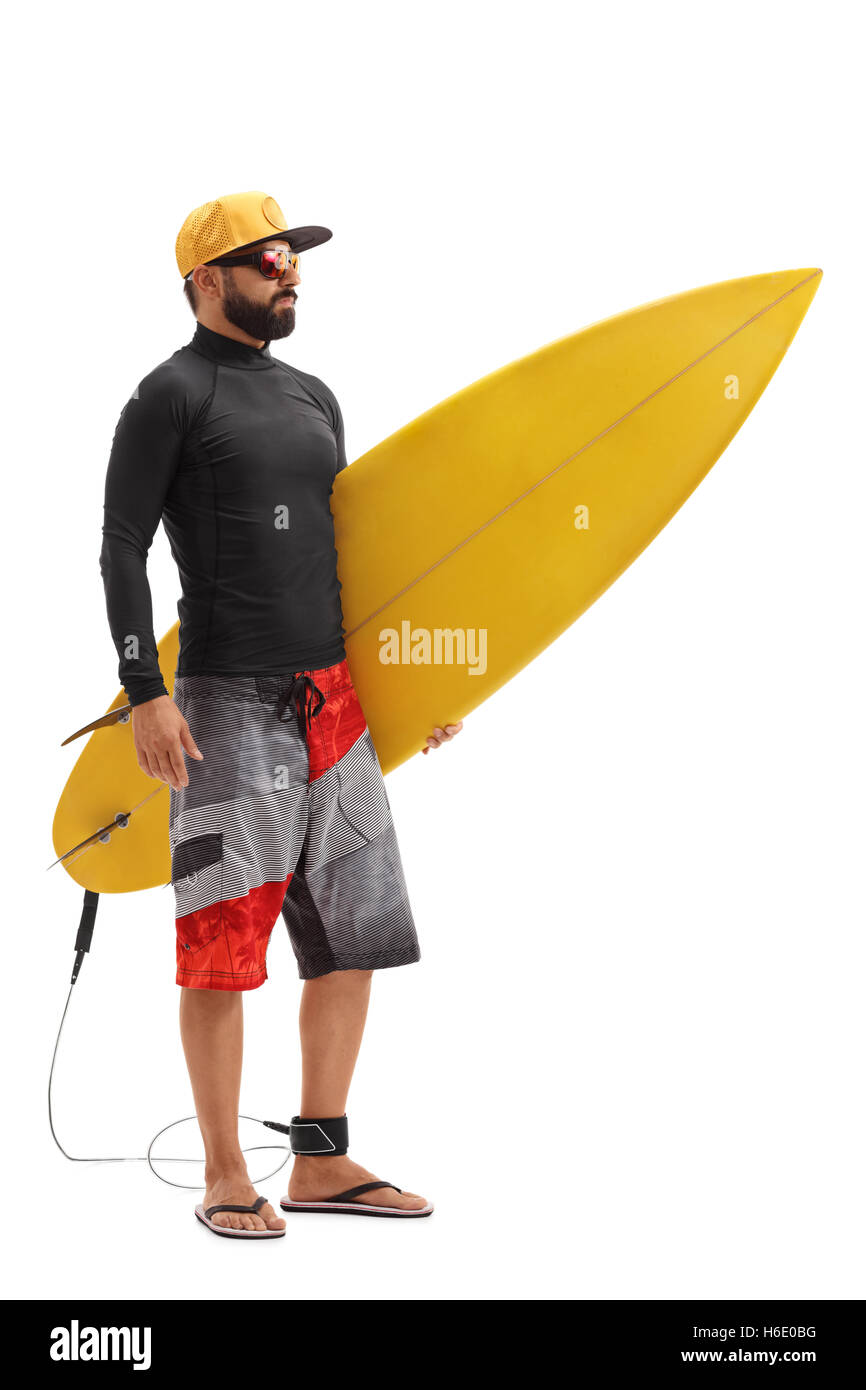 Full length portrait of a male surfer holding a surfboard isolated on white background Stock Photo