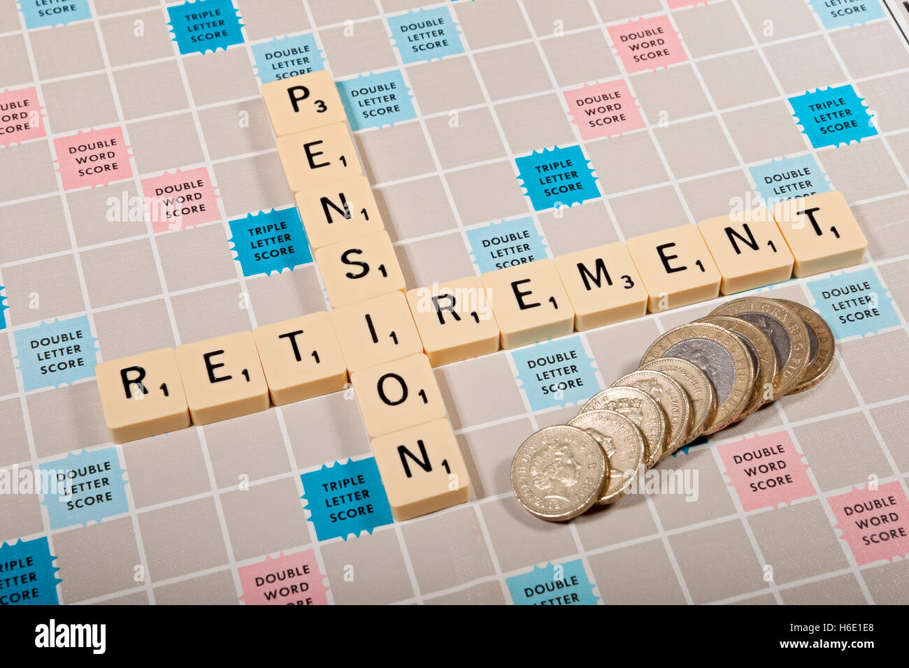 Scrabble board and tiles personal finance pension pensions retirement concept England UK United Kingdom GB Great Britain Stock Photo