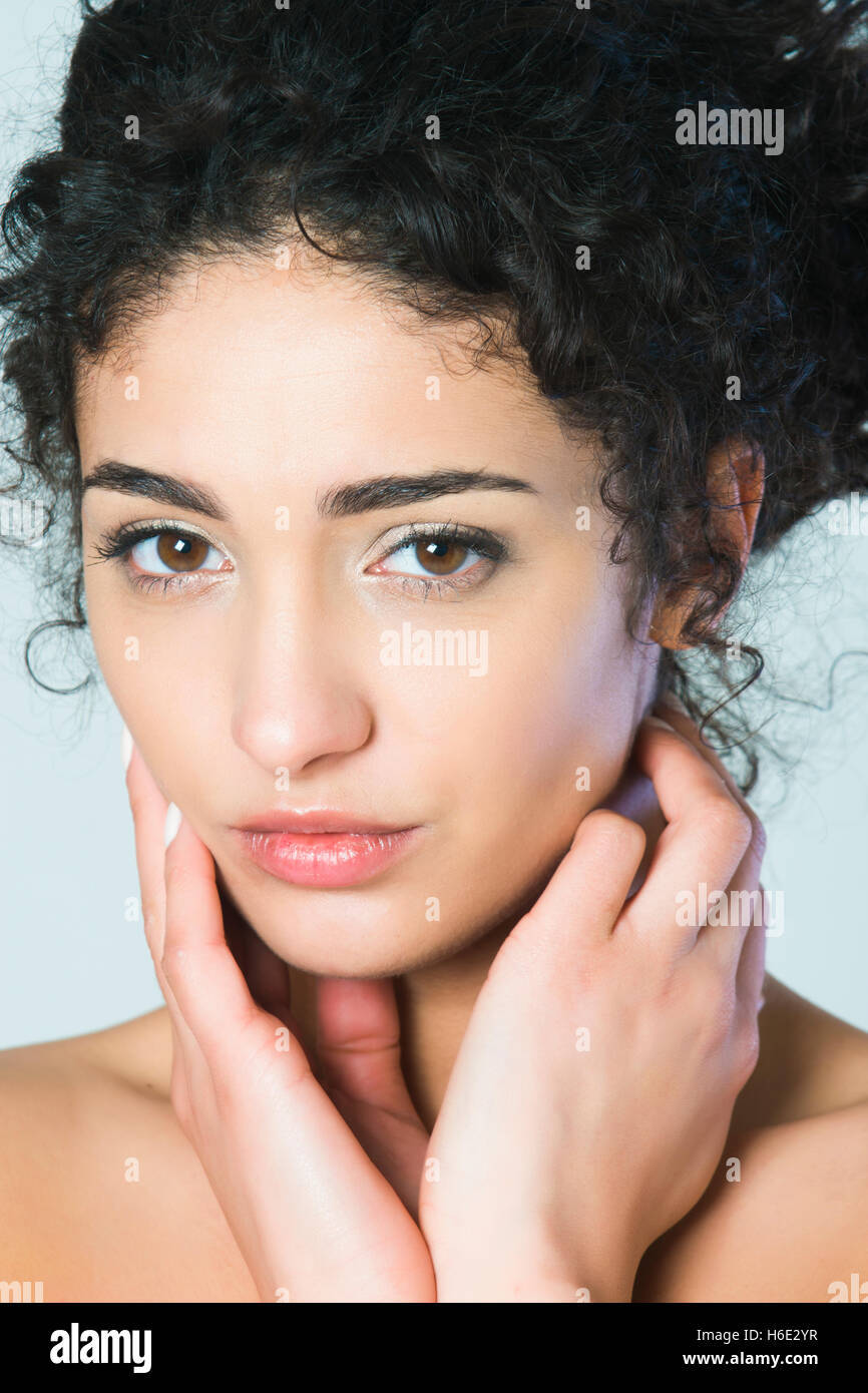 Beautiful young woman hands touching face Stock Photo - Alamy