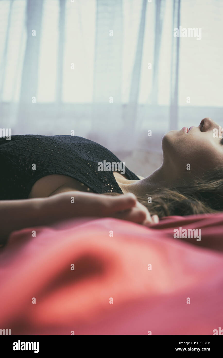 Woman laying down in bed hires stock photography and images Alamy