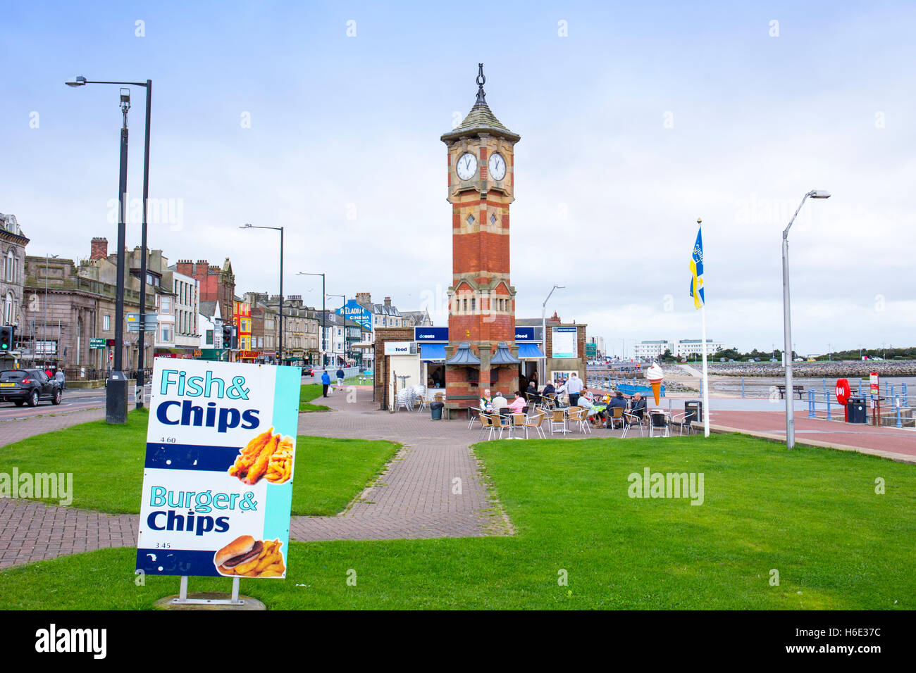 Clock tower with fish & chips shop in Morecambe Lancashire UK Stock