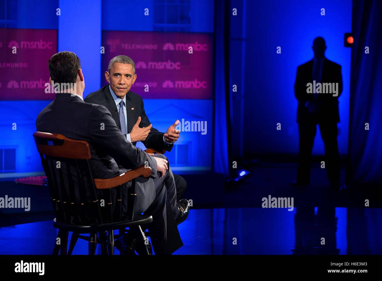 TV anchorman Jose Diaz-Balart interviews U.S. President Barack Obama for a immigration town hall special hosted by Telemundo and MSNBC at Florida International University February 25, 2015 in Miami, Florida. Stock Photo