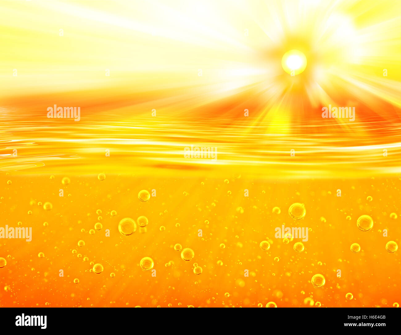 Honey sea. Orange yellow Liquid with oxygen bubbles. Orange yellow waves, sun, sky for  Oil, Honey, Beer, Juice. Stock Photo