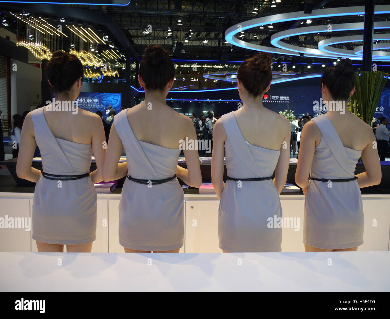 Four Chinese young girls are standing at the Beijing auto show 2016 Stock Photo