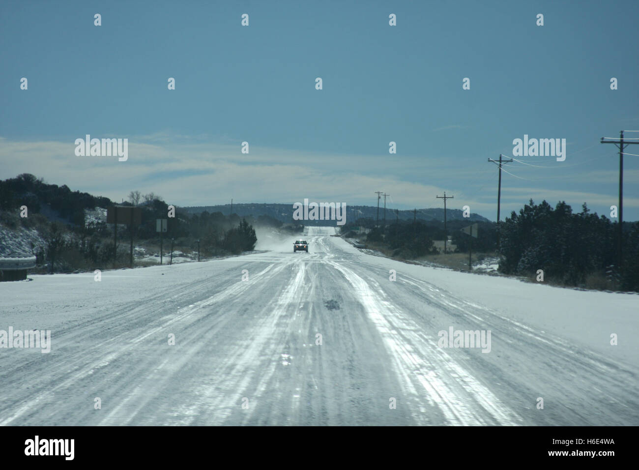 Driving on snowy roads in New Mexico Stock Photo