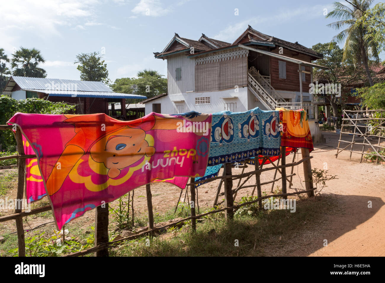 Village homes + drying towels, Cambodia Stock Photo