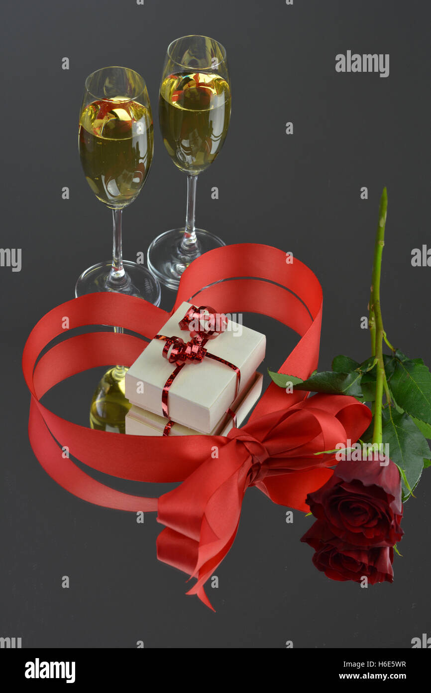 love present with champagne and rose Stock Photo Alamy