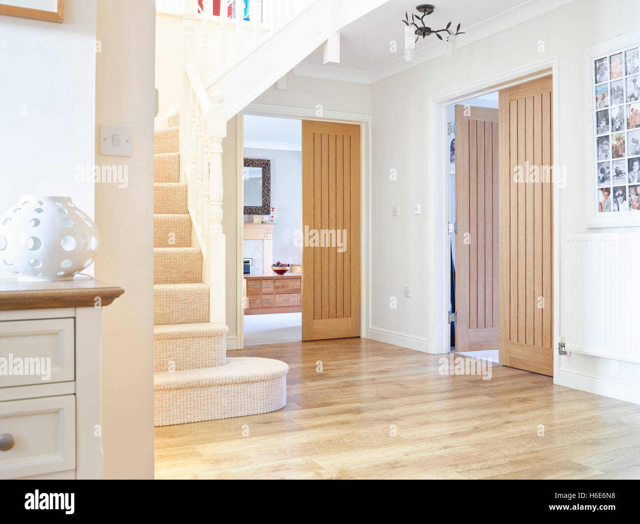 The entrance hallway of a contemporary UK home showing the connection & layout of the adjoining rooms Stock Photo
