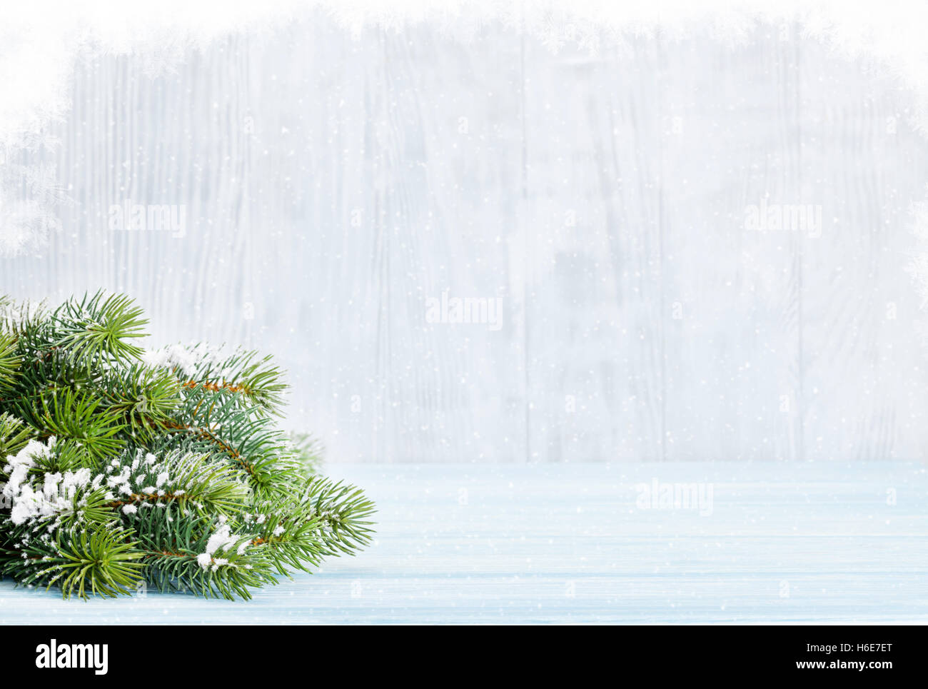 Christmas wooden background with snow fir tree. View with copy space ...
