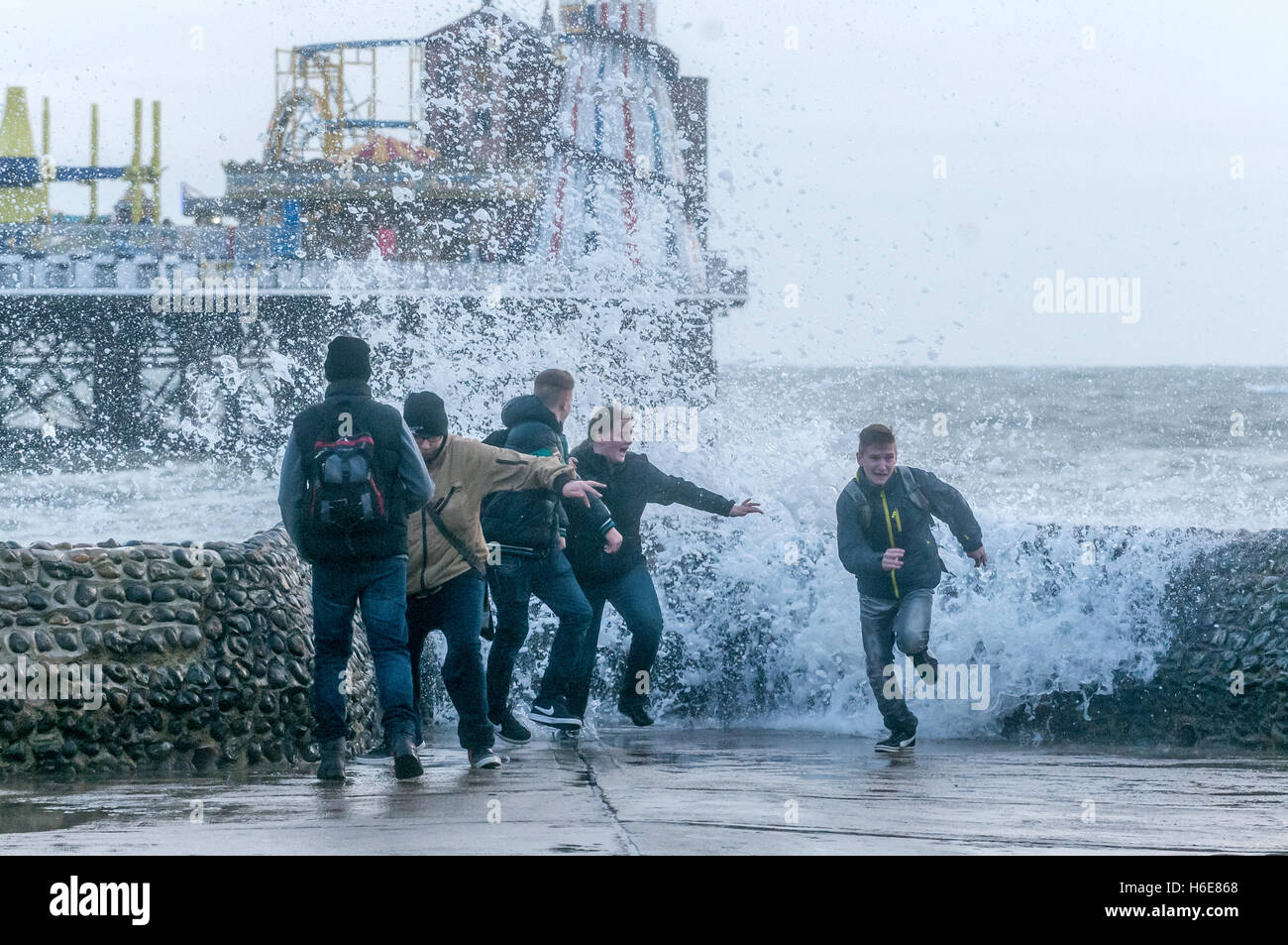 Waves crashing onto Brighton seafront Stock Photo