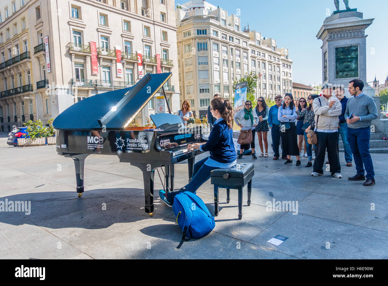 A female pianist plays piano in front of many on-lookers during Madrid full  of pianos in Madrid, Spain Stock Photo - Alamy
