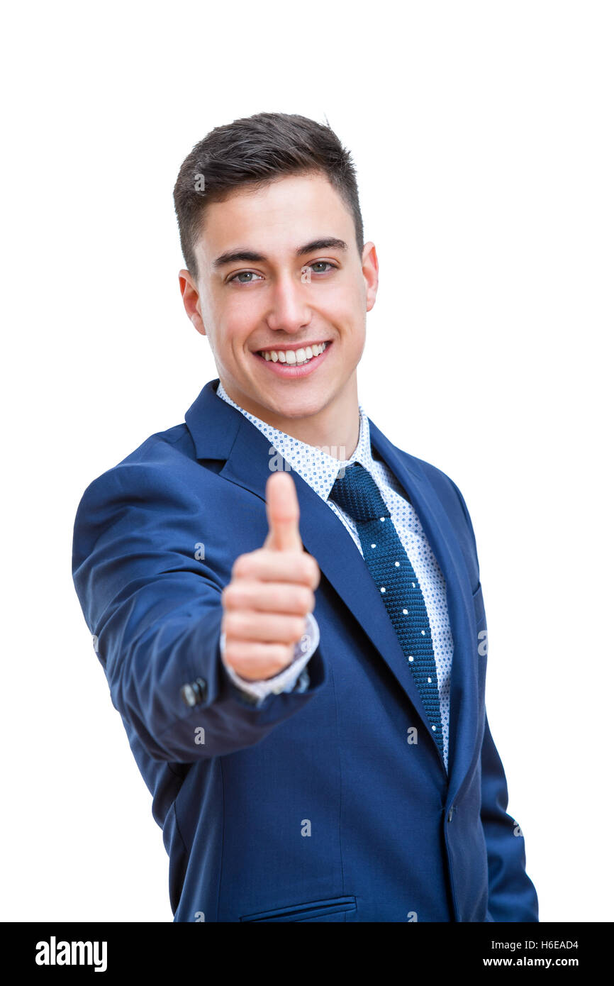 Close up portrait of Young Businessman in suit doing thumbs up. Young smiling business student Isolated on white background. Stock Photo