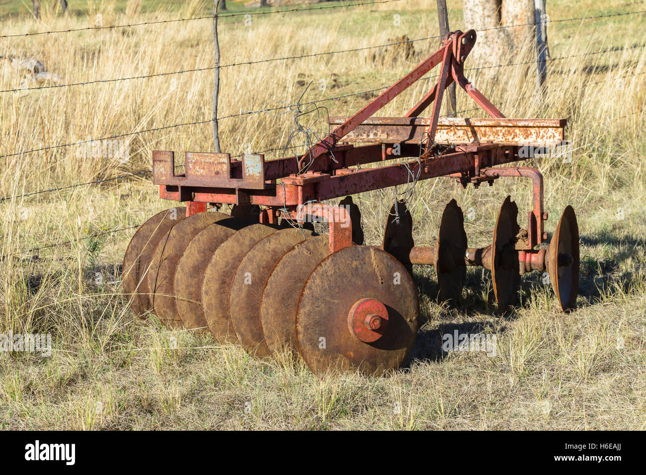 Farming old mechanical tractor vintage earth plows Stock Photo