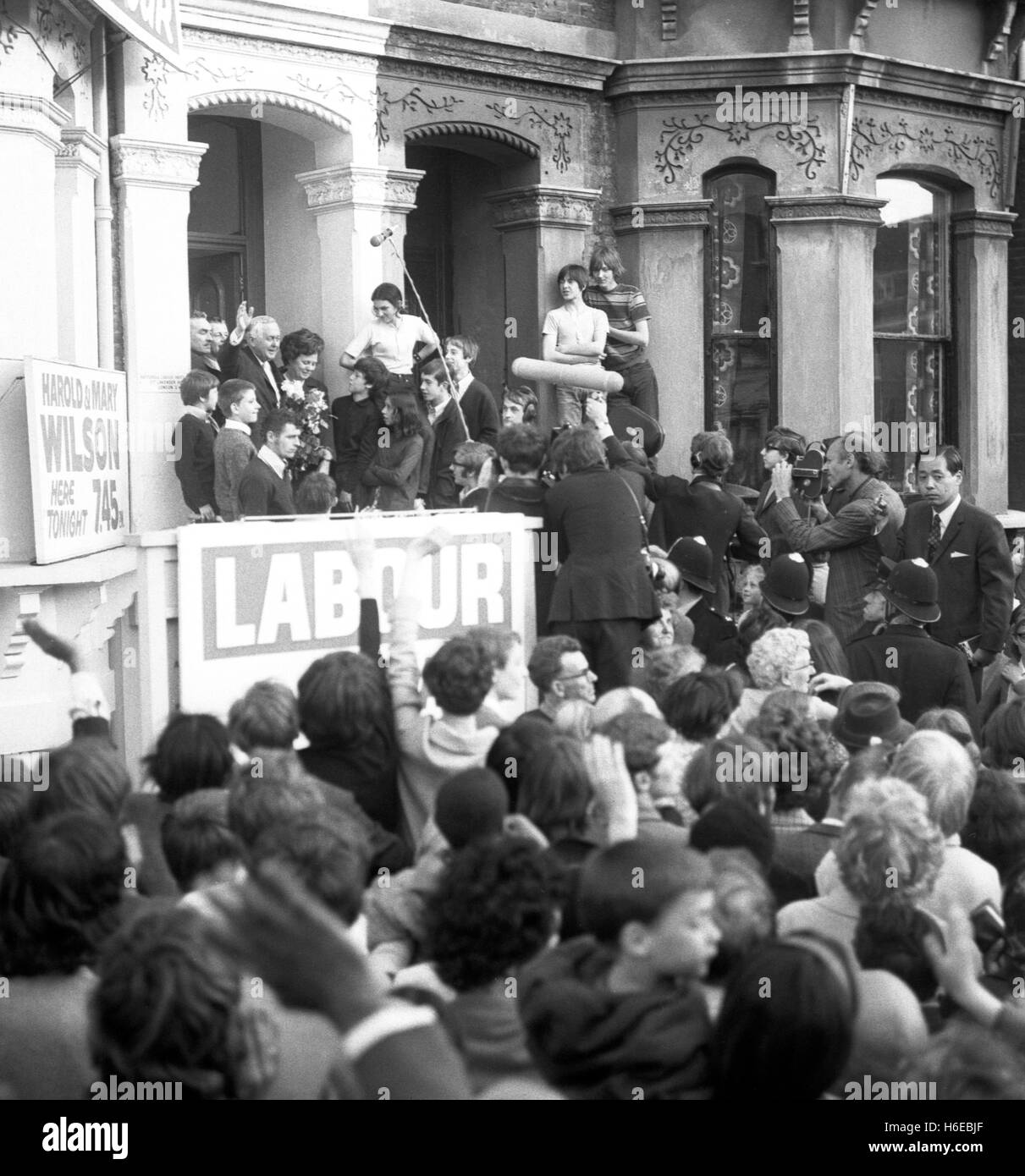Prime Minister Harold Wilson and his wife, Mary, acknowledge (doorway left) the Labour Party supporters, who mobbed the Battersea headquarters of the party, on arrival in Lavender Hill, London. PA AF 145826-57 Stock Photo