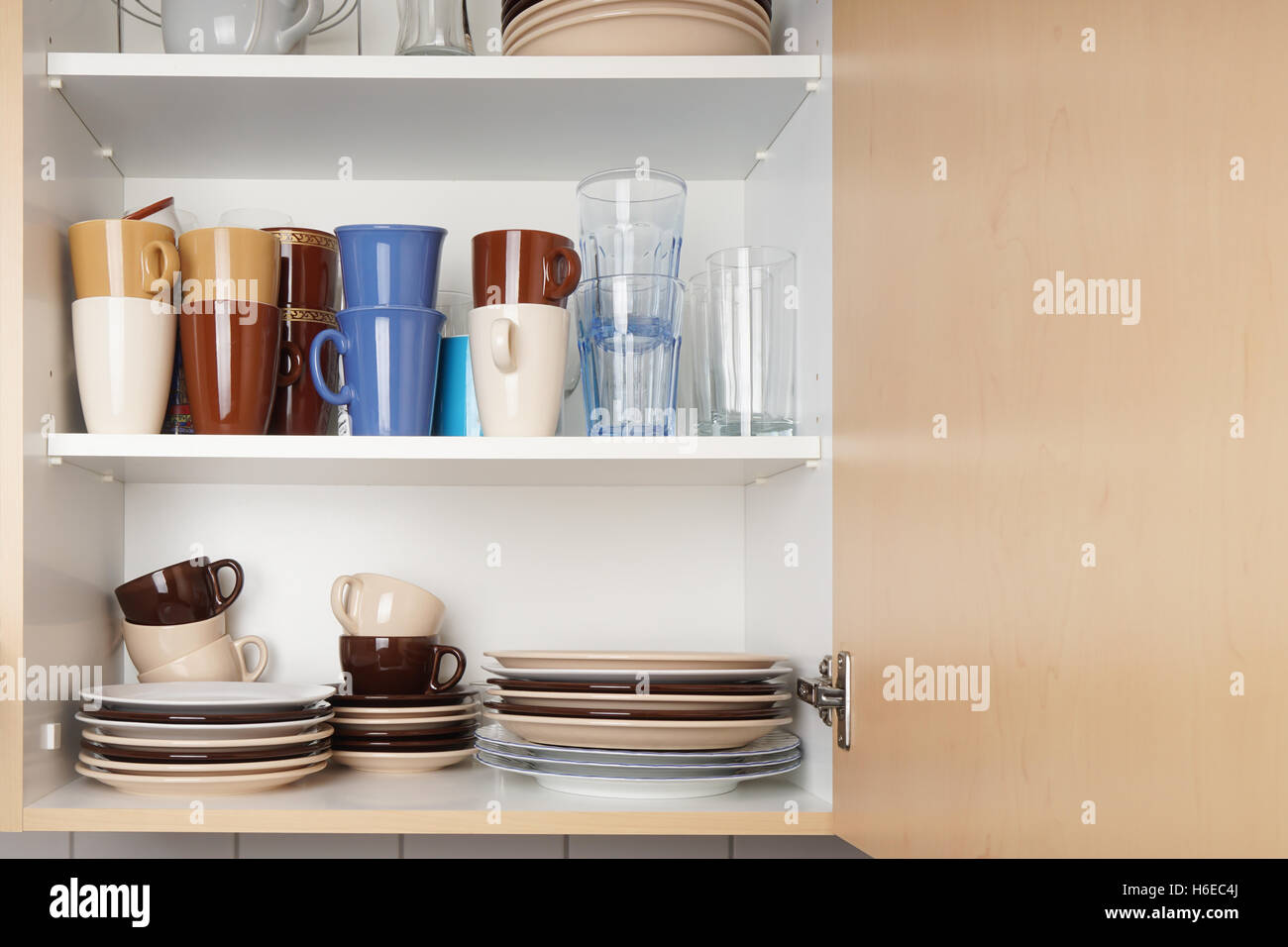 kitchen cabinet or cupboard for dishes Stock Photo