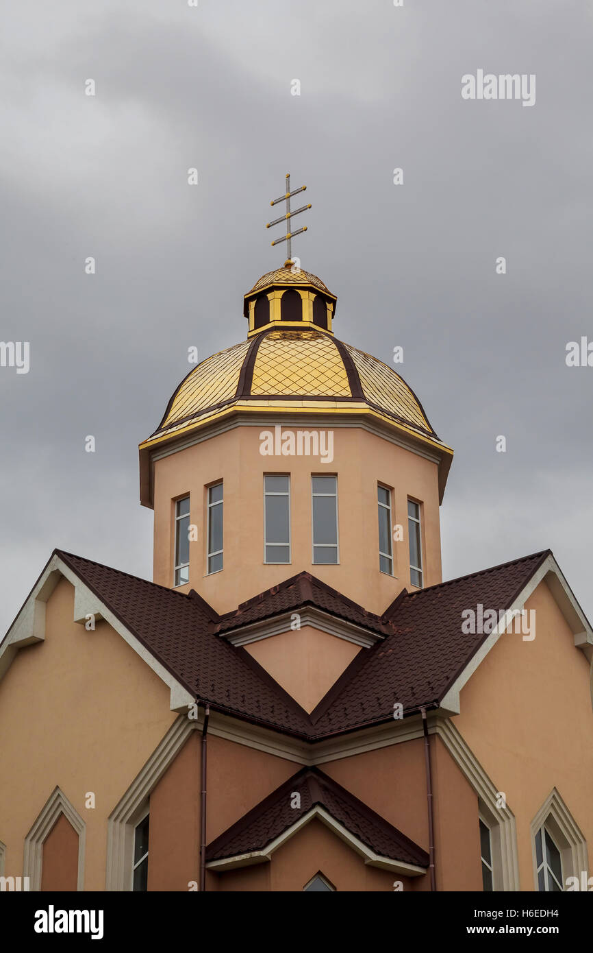 Golden domes orthodox church with cross against blue sky Stock Photo ...