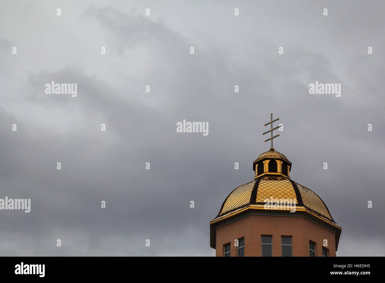 Golden domes orthodox church with cross against blue sky Stock Photo ...