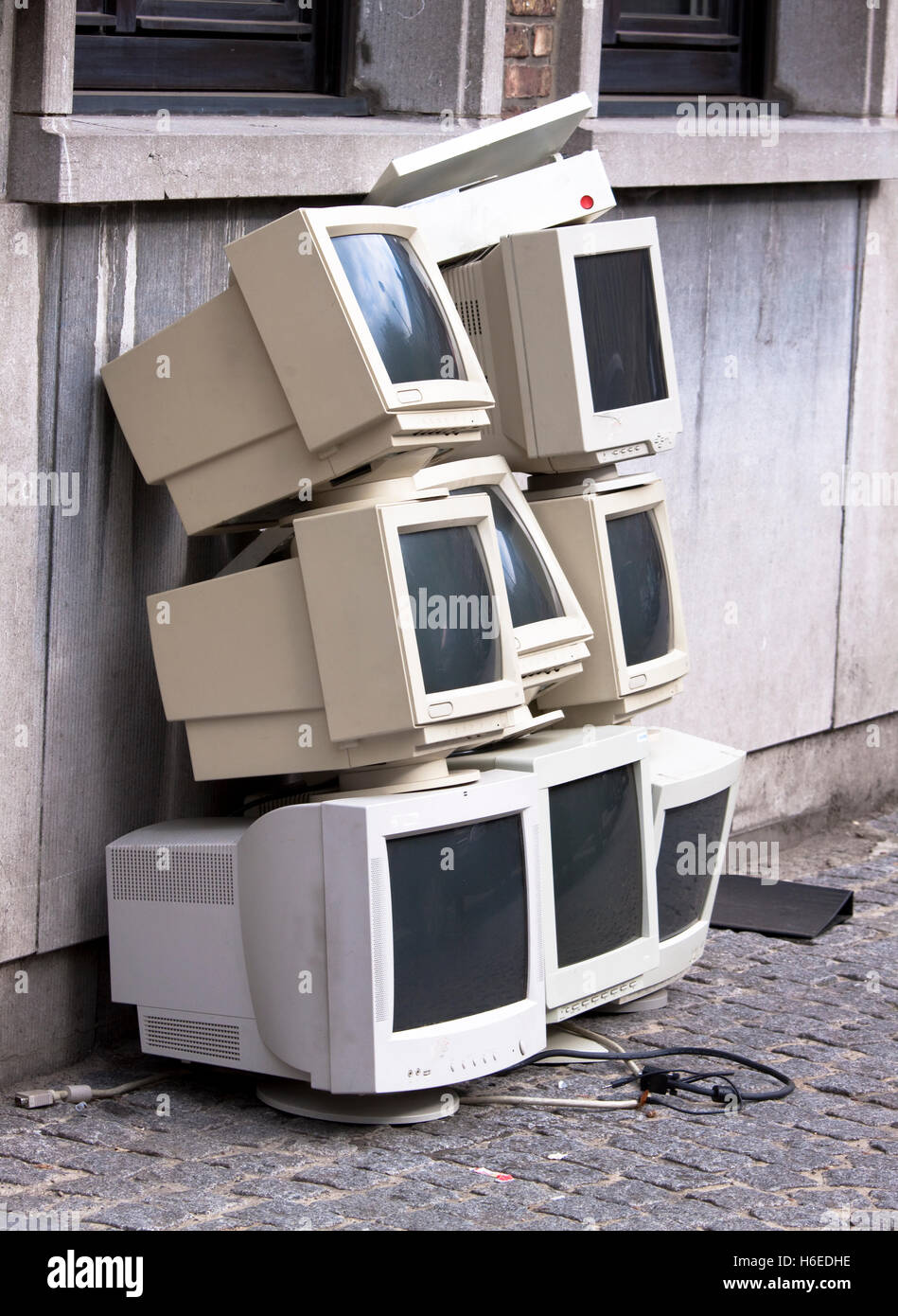 Pile of eight old crt monitors awaiting disposal Stock Photo