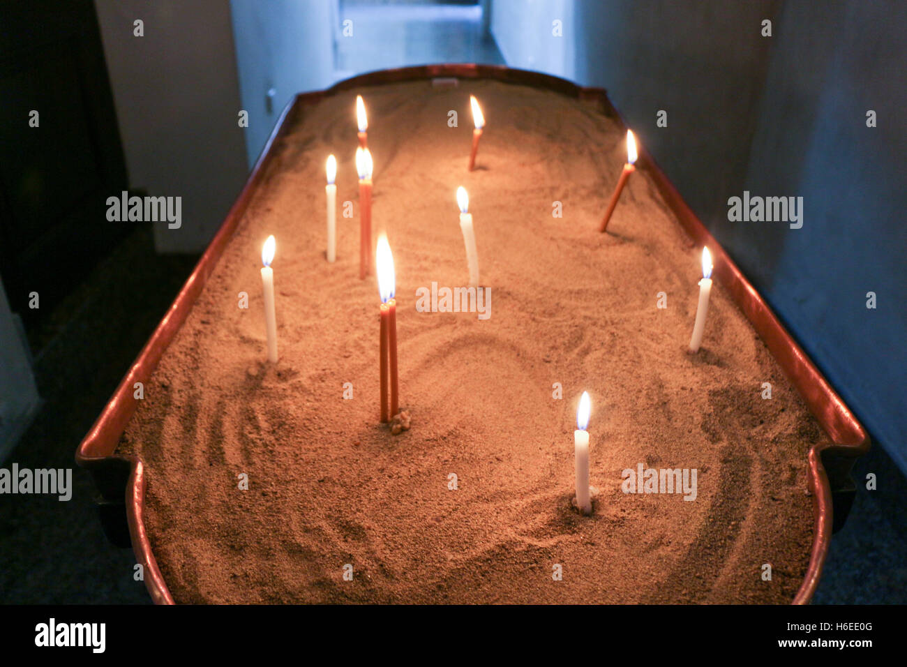 Candles burning over dark background in a church Stock Photo - Alamy