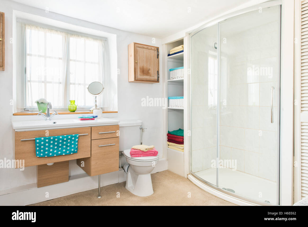 A fresh, clean bathroom with walk in shower in a moderate sized UK home Stock Photo