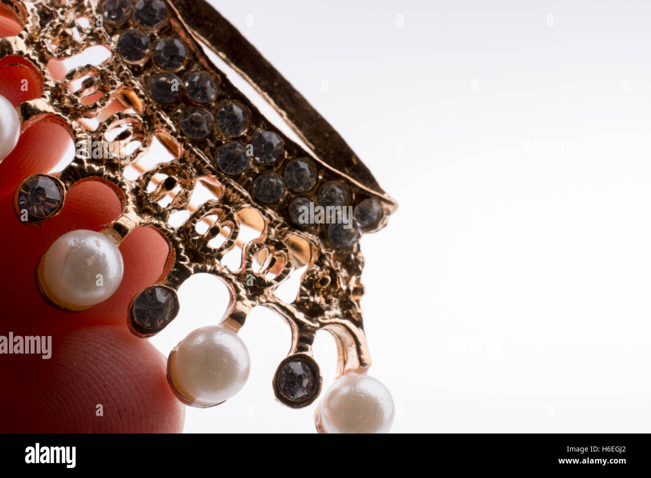 Golden color crown model with pearls on white background Stock Photo ...