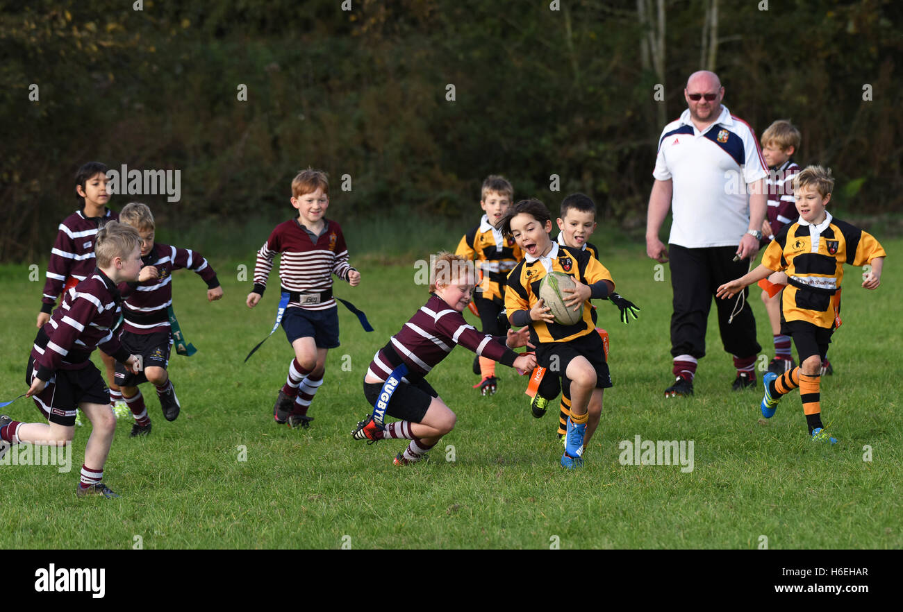 Junior childrens tag rugby match action Britain Uk children childrens sport  healthy activity sport boys sports Stock Photo