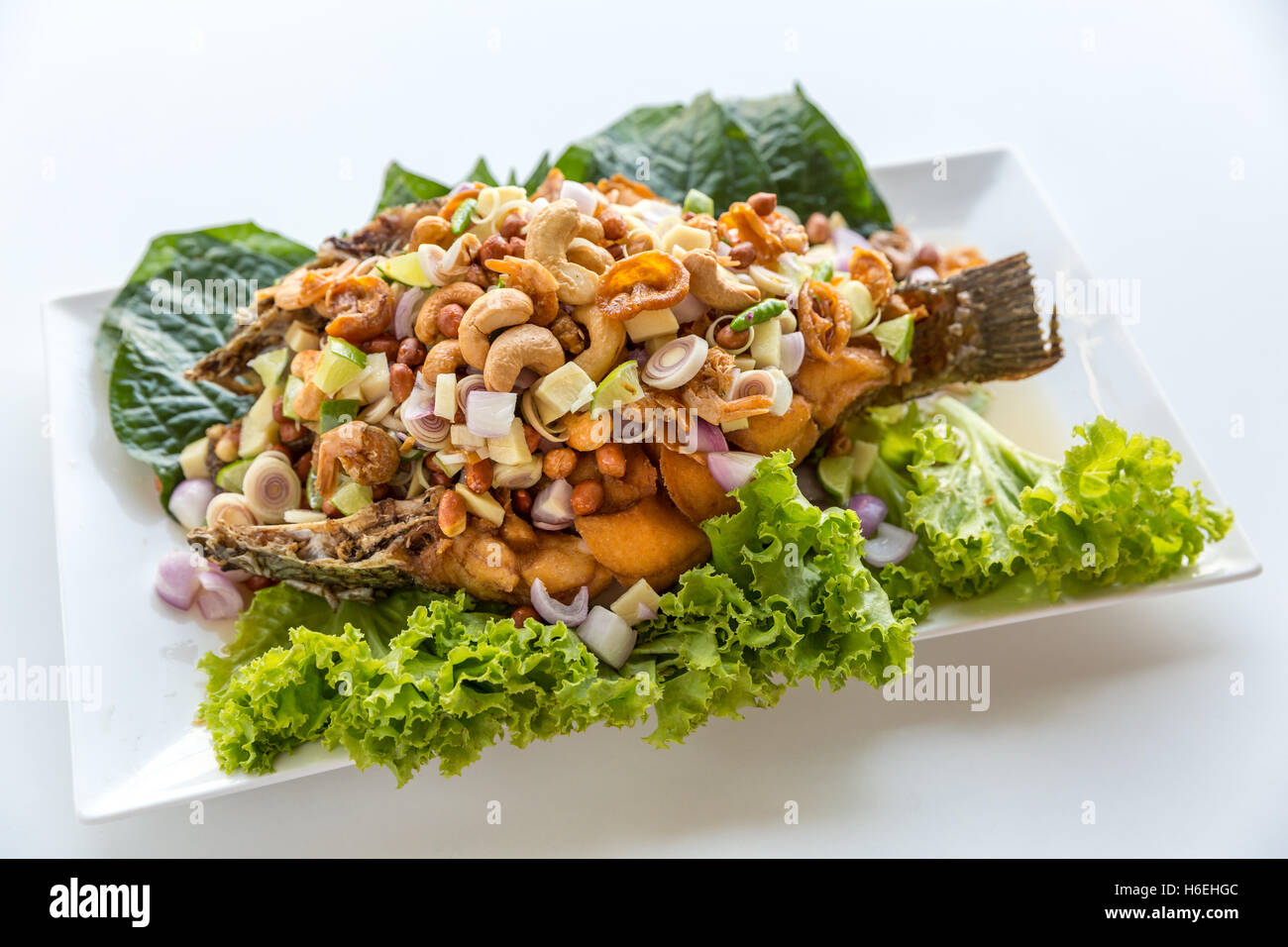 deep fried fish with salad Thai style Stock Photo - Alamy