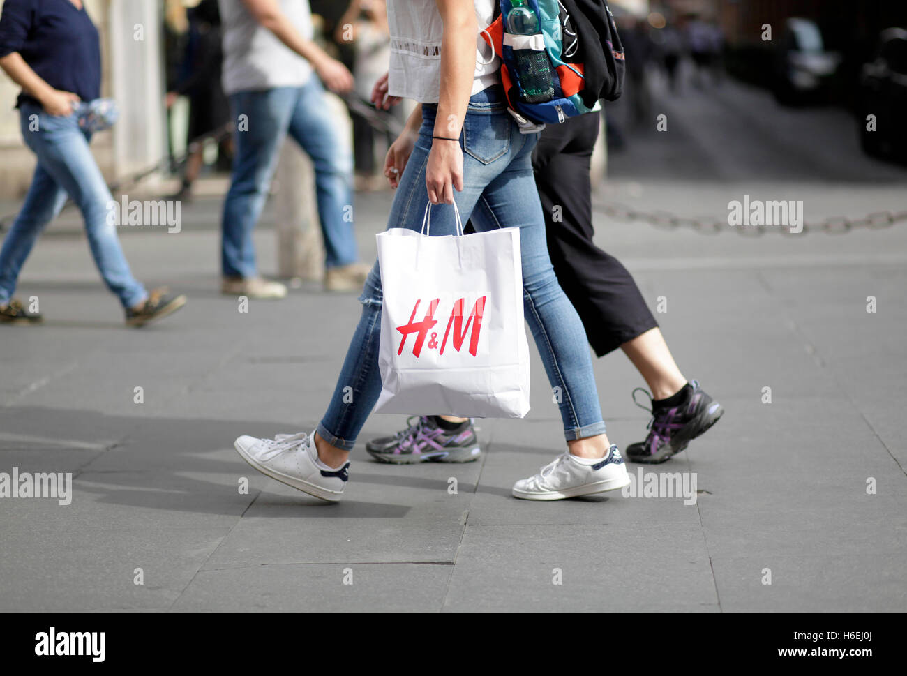 Pedestrian walks with her H&M shopping bag on Via del Corso, main shopping  street in Rome, Italy Stock Photo - Alamy