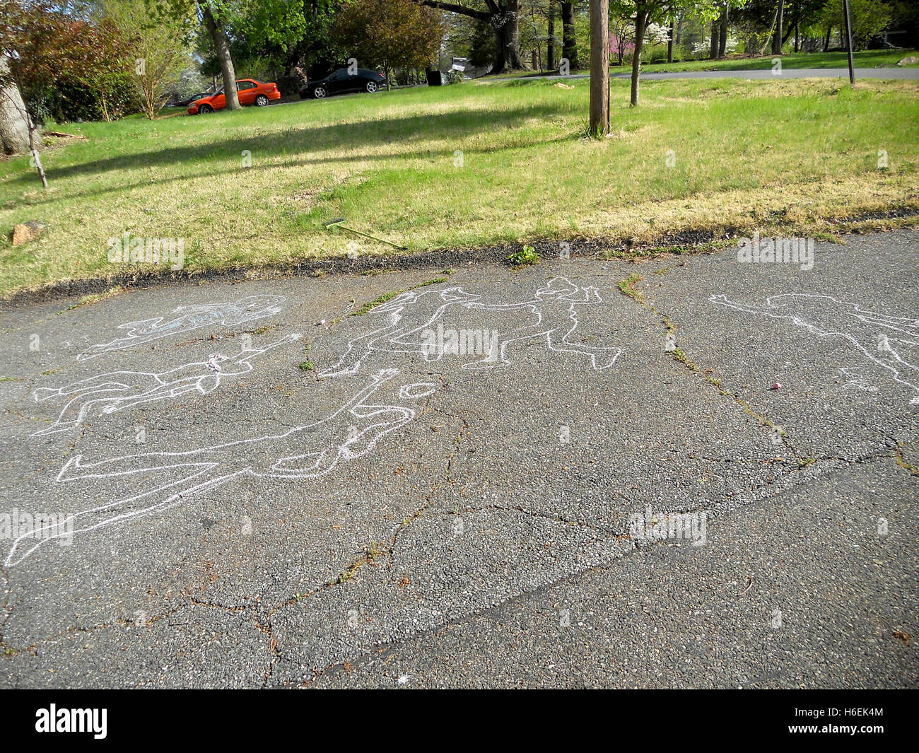 Funny human shapes traced on asphalt Stock Photo