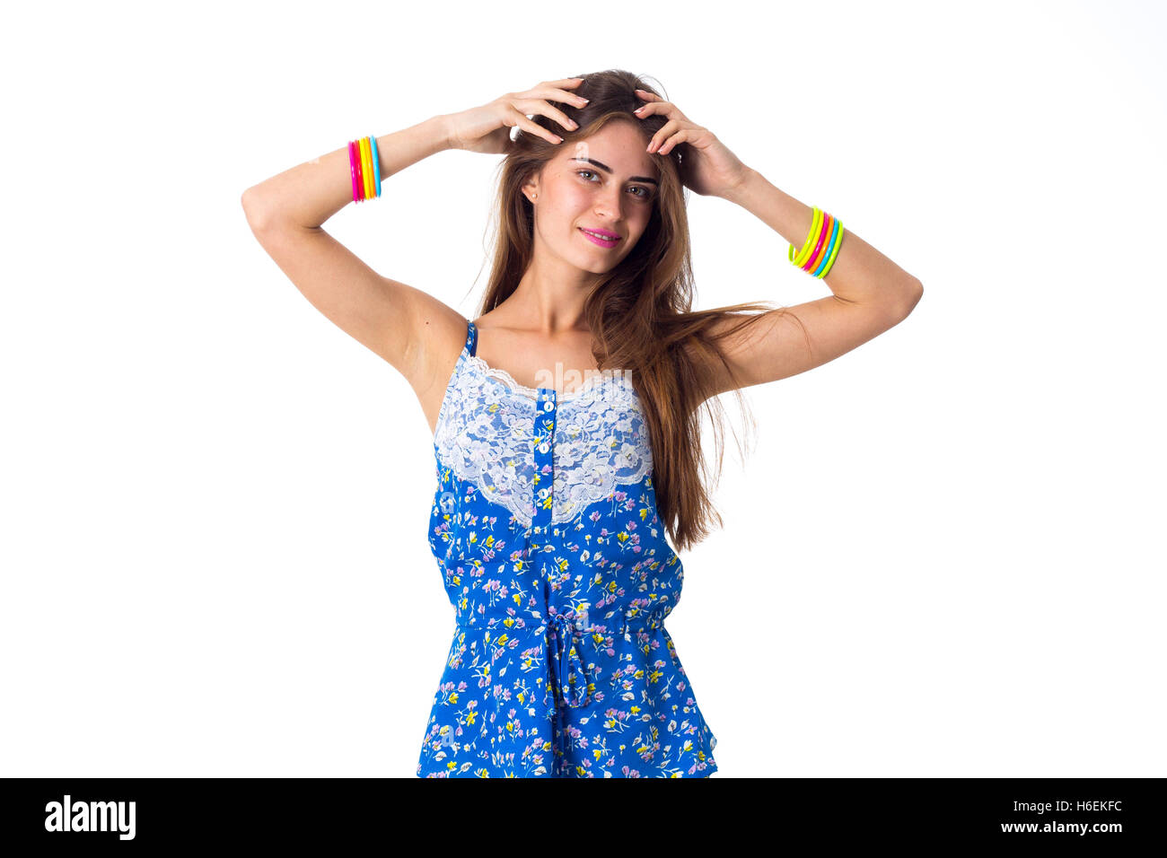 Woman holding hands on her head Stock Photo - Alamy