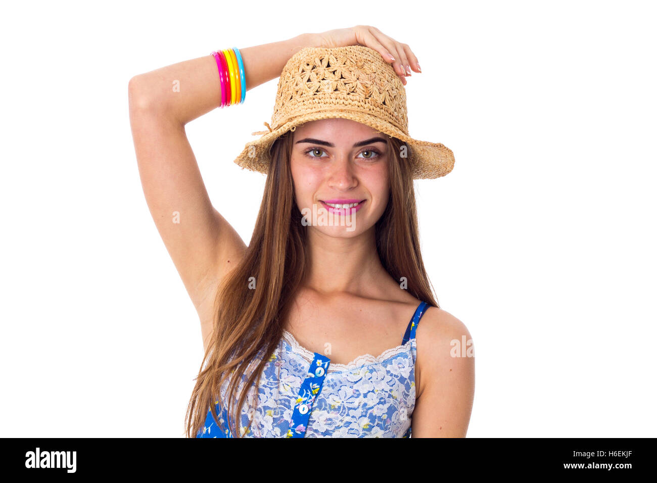 Woman in hat holding hand on her head Stock Photo - Alamy