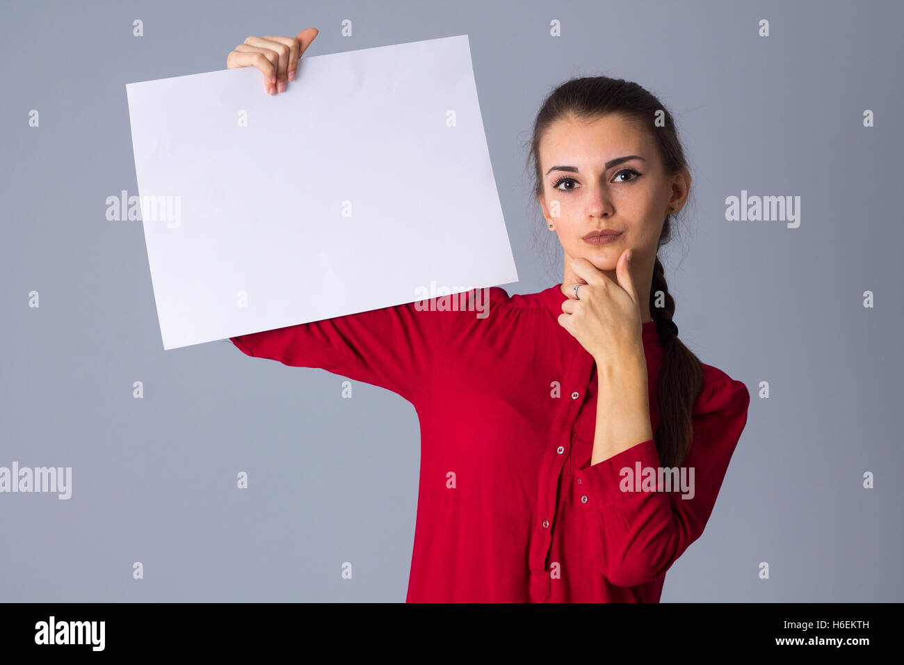 Woman holding white sheet of paper Stock Photo Alamy