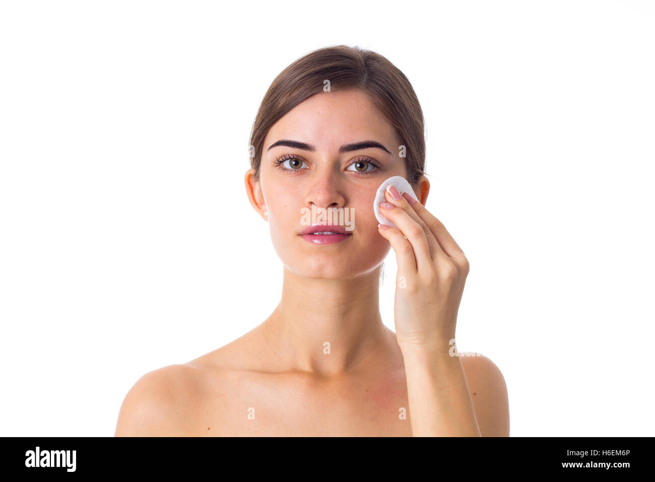 Young woman using cotton pads Stock Photo