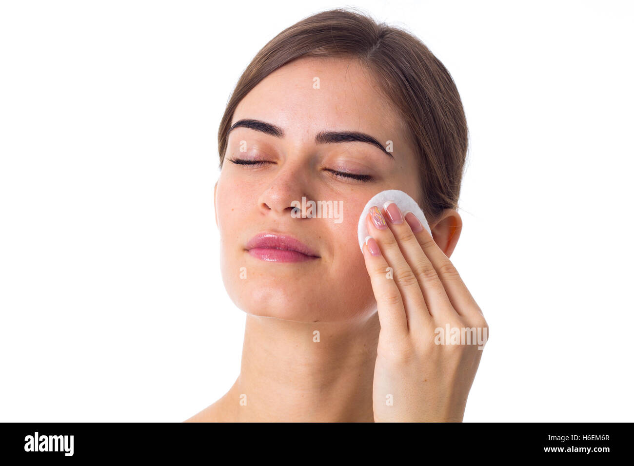 Young woman using cotton pads Stock Photo