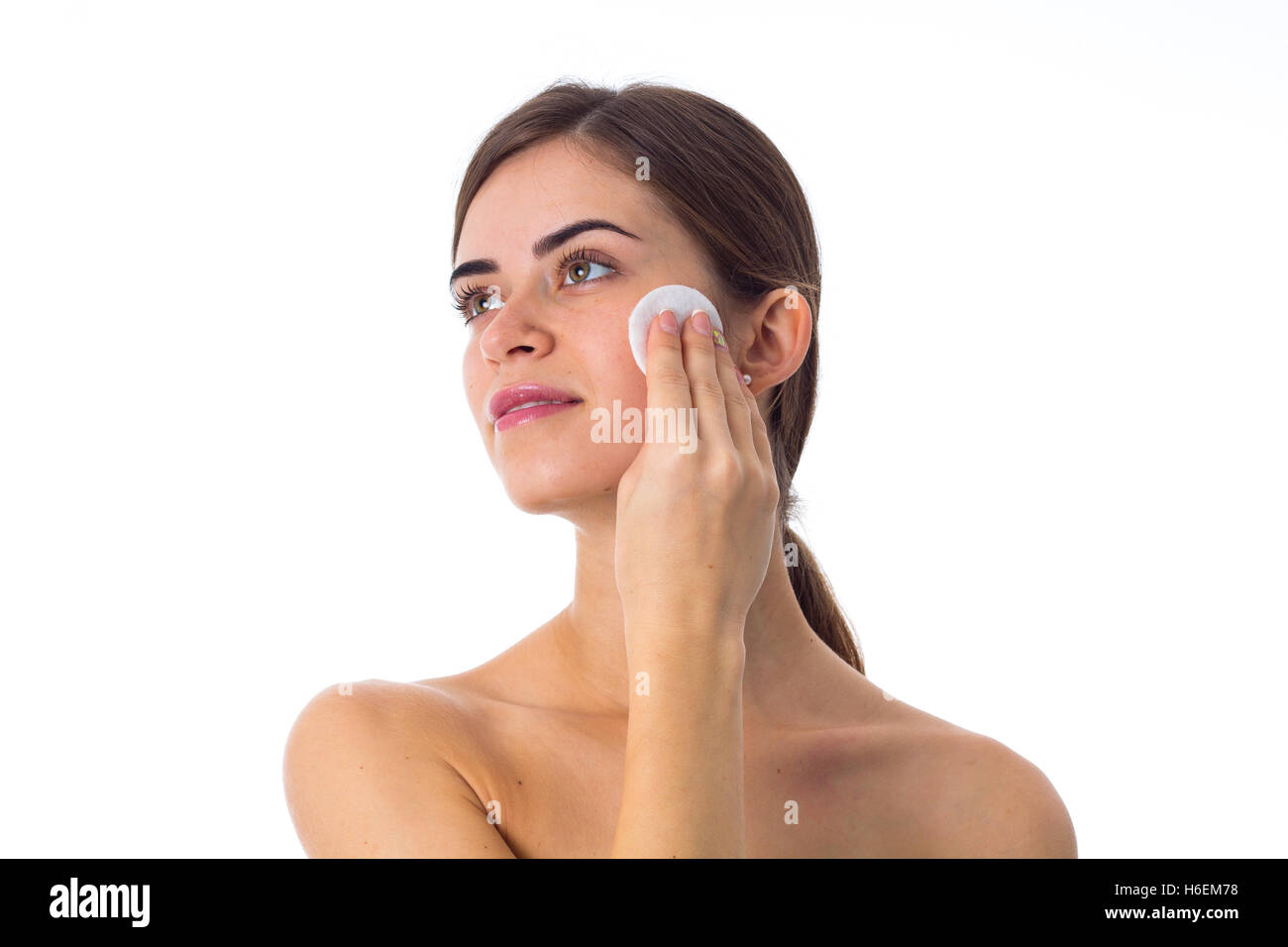 Young woman using cotton pads Stock Photo