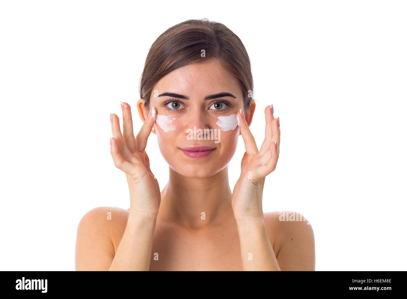 Young woman using cream Stock Photo - Alamy