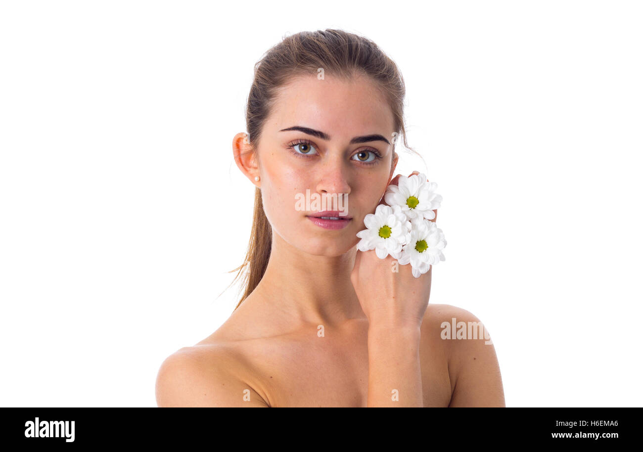 Young woman holding white flowers Stock Photo - Alamy