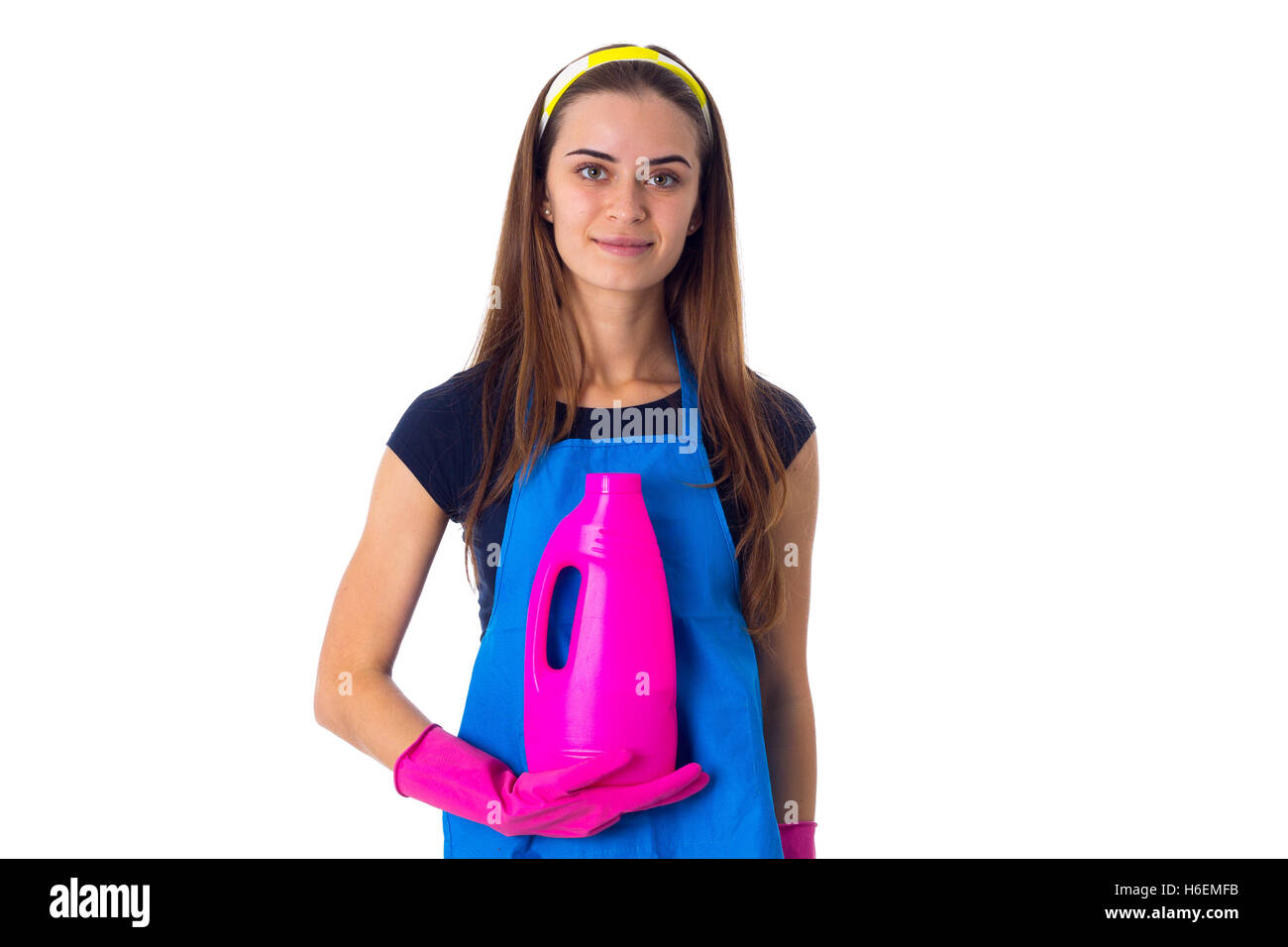 Woman in apron holding a detergent Stock Photo - Alamy